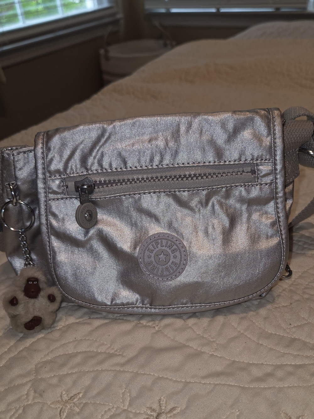 Kipling Silver Crossbody Bag with Signature Monkey Charm